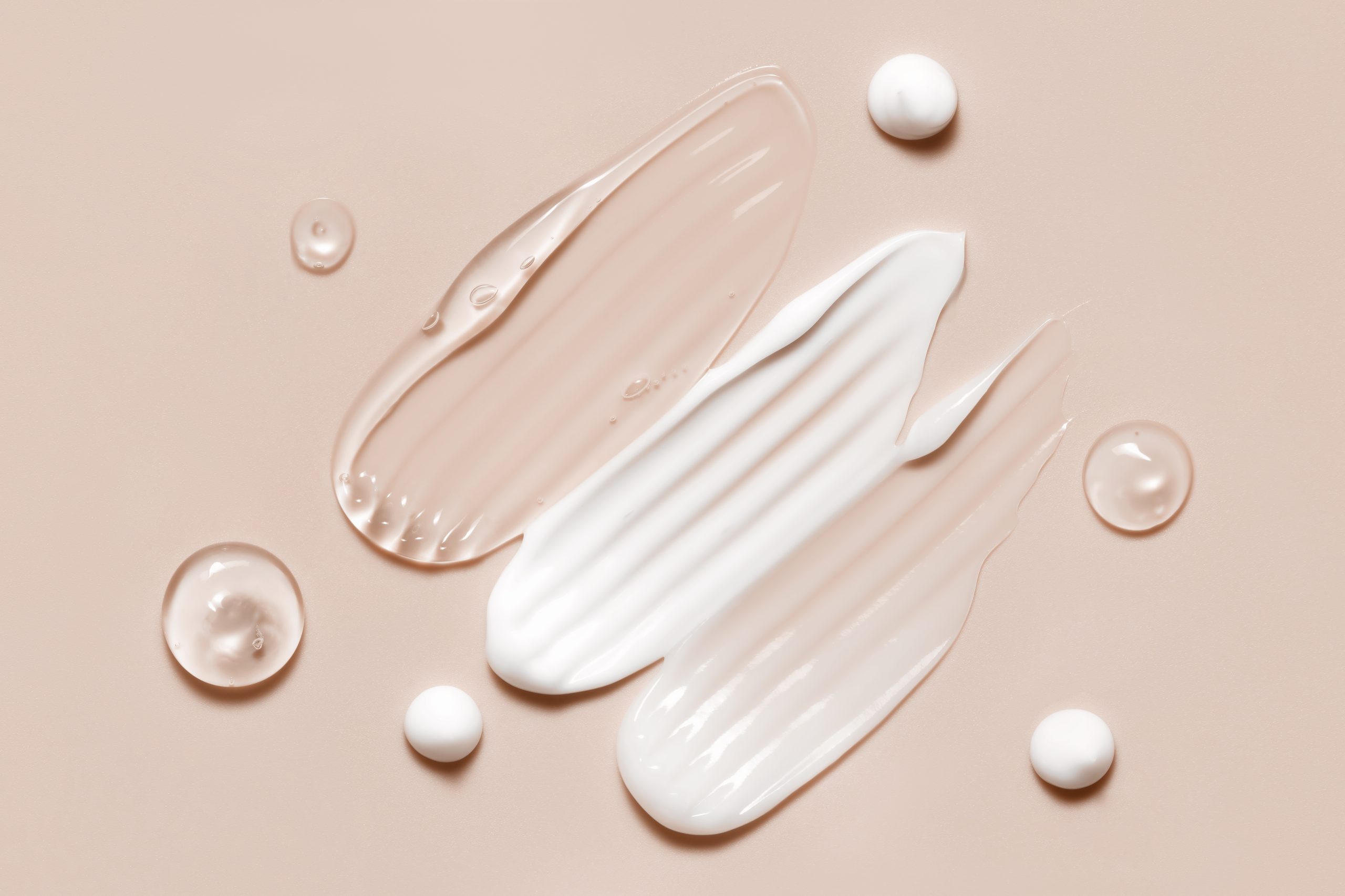 cosmetic cream gel smears on peach backdrop